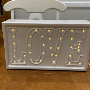 NWT.  Decorative ceramic light up “LOVE” figure.